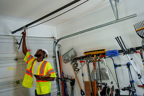 Professional Garage Door Panel Replacement technician working in Lowell, MA